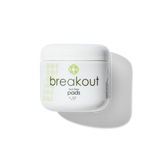 White container of Candee Skin Brand 'breakout' tea tree pads on a white background