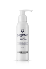 White bottle of 'Candee Skin Brand brighten' turmeric cleanser on a white background