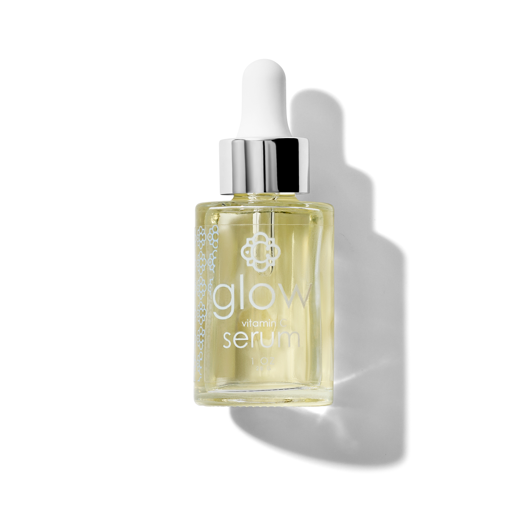 Glass serum bottle Candee Skin Brand 'glow vitamin C serum' on a white background