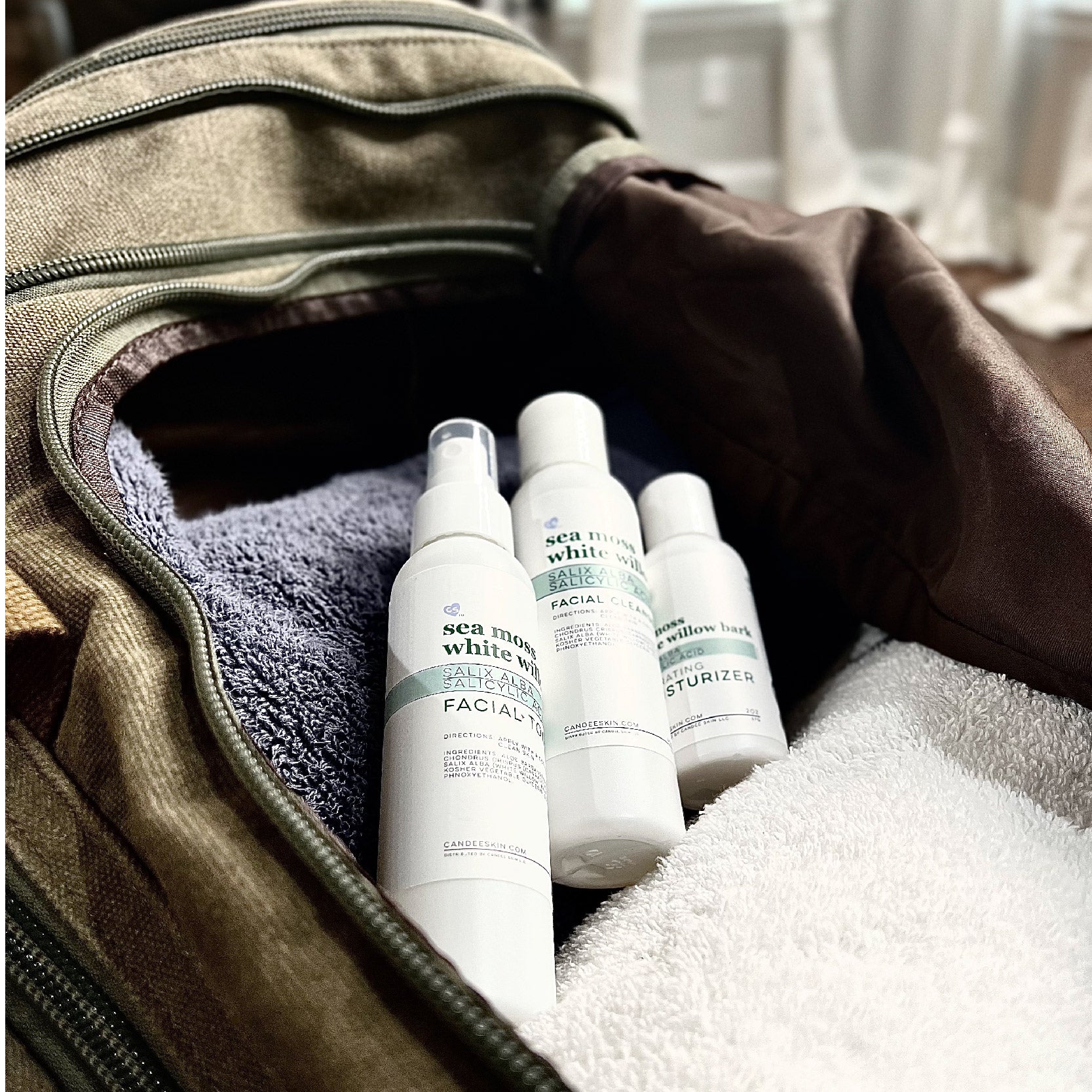 Sea Moss-White Willow Bark Facial Moisturizer, Moisturizer and Facial Toner in duffel bag. Candee Skin Shop. Skin Science Simplified.